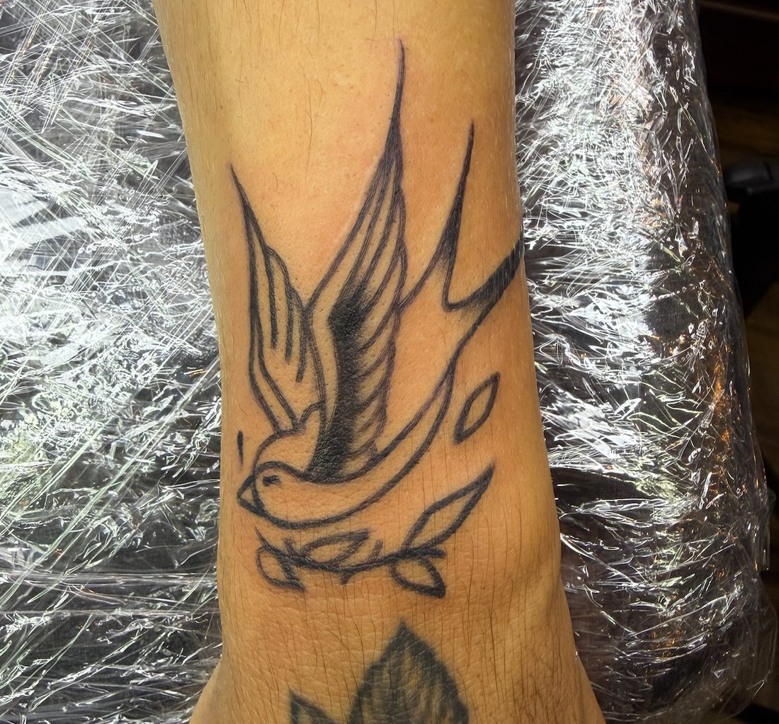 Swallow bird line tattoo
